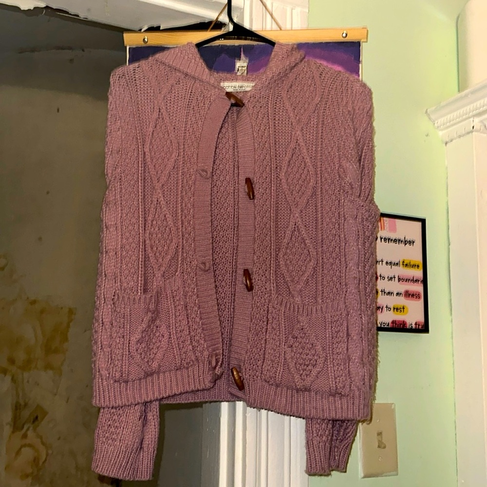 A sweater with pockets and long sleeves